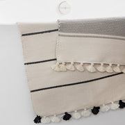 Striped back rug with tassels