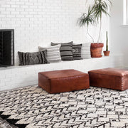Moroccan boucherouite rugs in black and white styled in living room