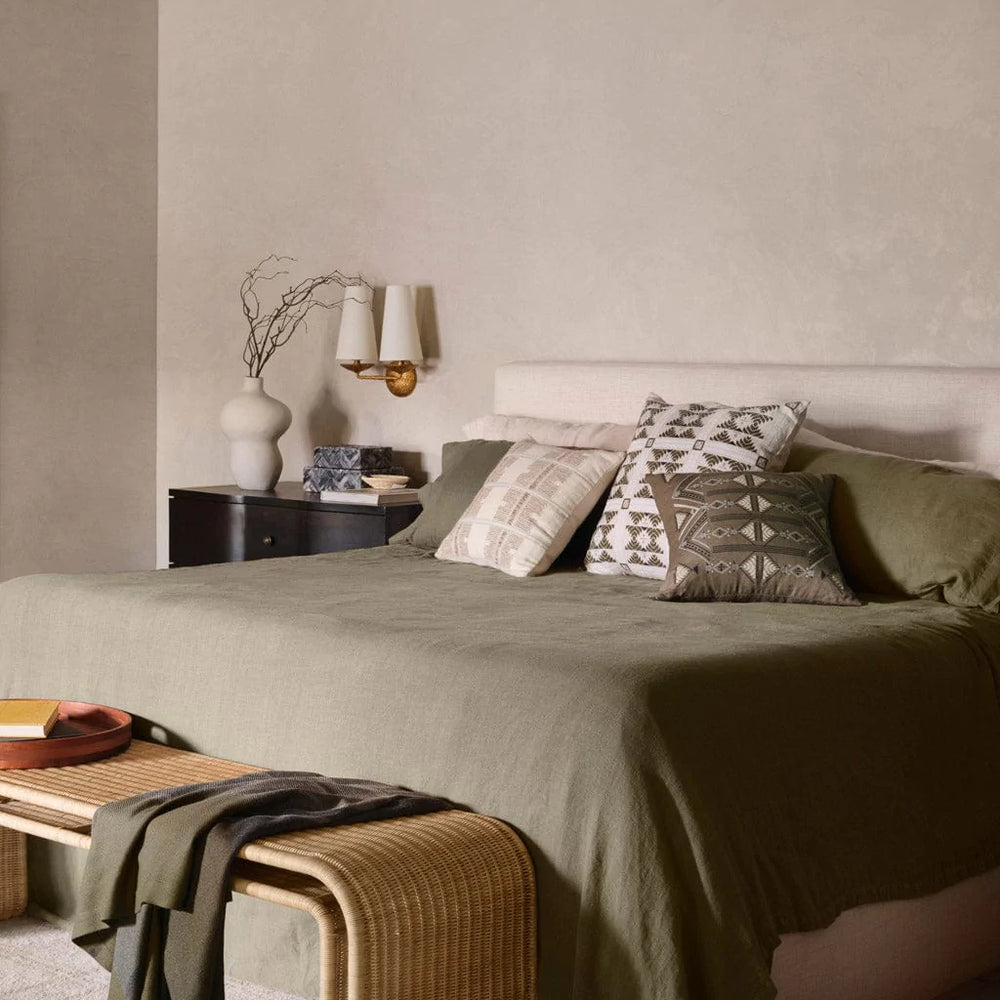 Throw pillows styled on bed