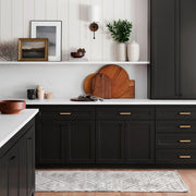 Woven Grey Wool Runner in Kitchen with Black Cabinets.