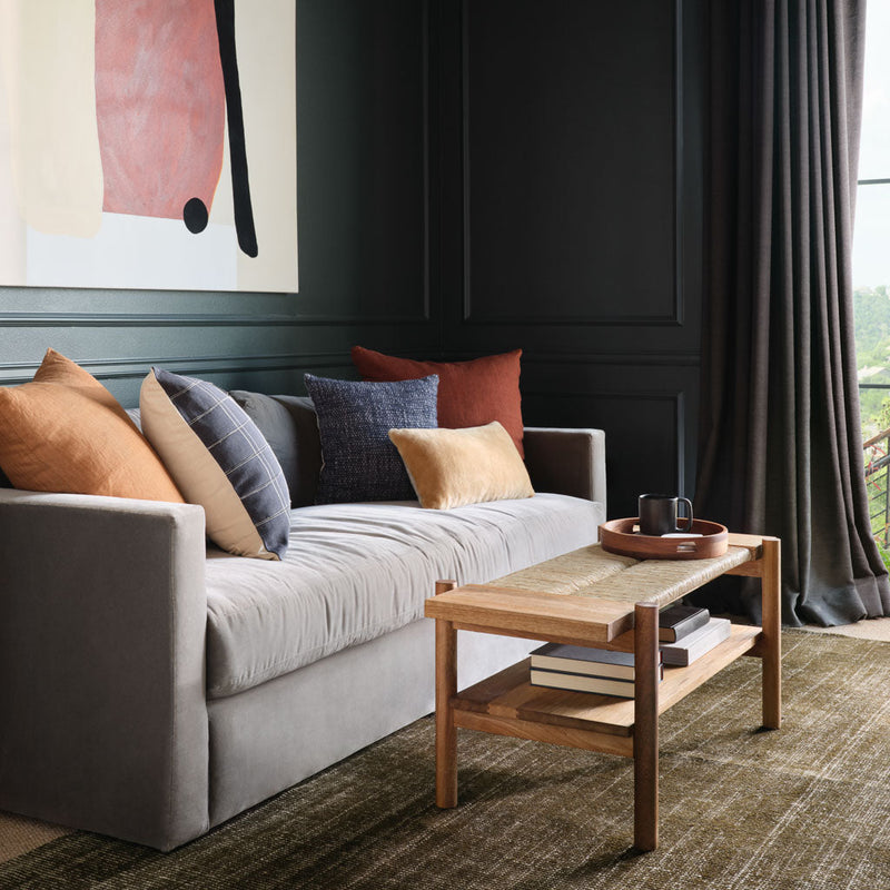 Olive wool area rug styled in moody study, olive