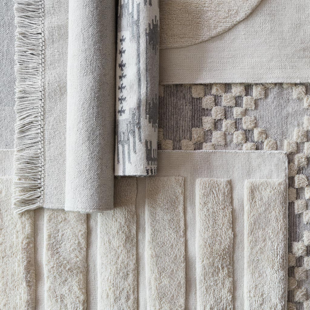 Collection of Neutral Textured Rugs at The Citizenry