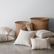 Cotton Throw Pillows and Woven Baskets from The Colombia Collection
