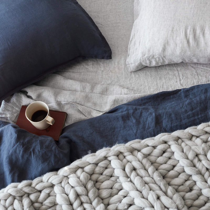Navy and Striped Linen Bedding Overhead with Chunky Knit Throw, graphite-stripe
