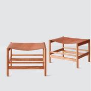 Two leather and wood stools