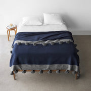 Navy blue cotton throw with grey tipe and large tasels