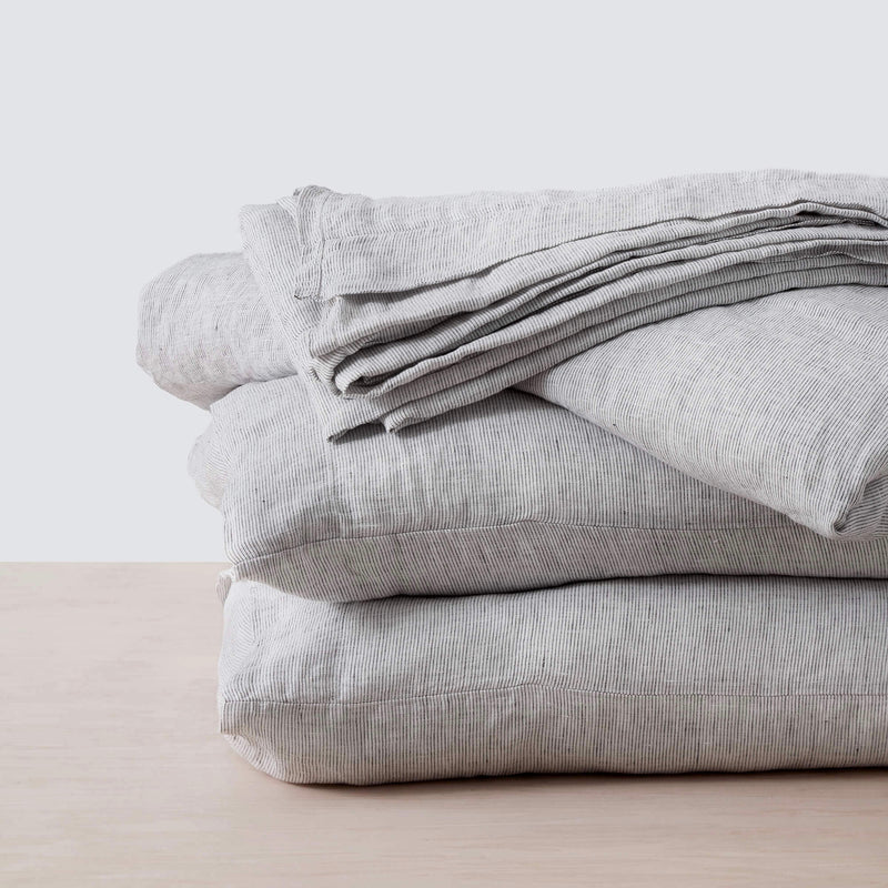 stack of grey striped linen bedding, graphite-stripe