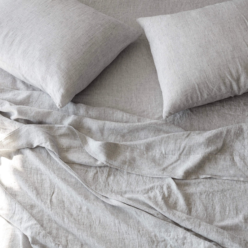 overhead of striped linen bedding, graphite-stripe