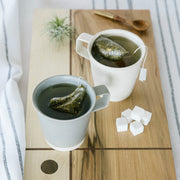 Handmade Irish Ceramic Mugs in Cream and Grey and Wooden Serving Board