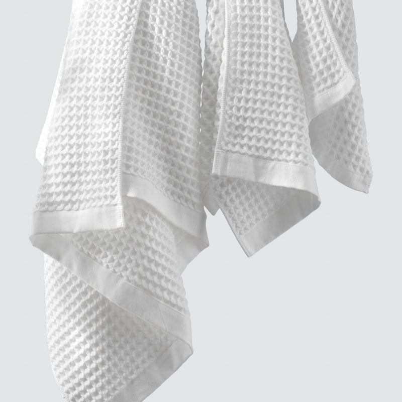 White waffle towels hanging, white