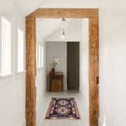 Woven runner in hallway with beams
