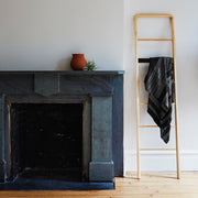 Black and Grey Alpaca Blanket Draped Over Ladder