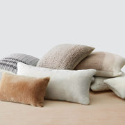 Pile of sheepskin and alpaca pillows