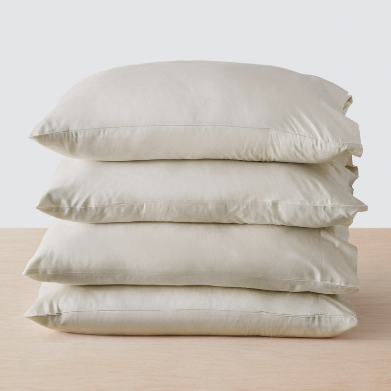 Stack of four pillows, solid-sand