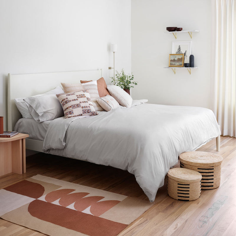 Throw pillows styled on duvet, solid-light-grey