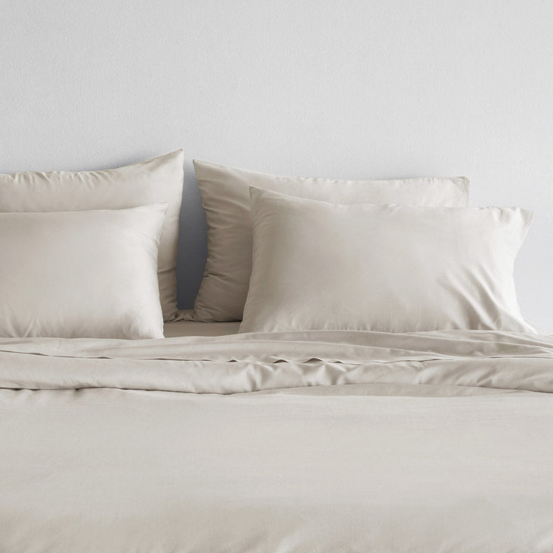 Organic turkish cotton pillowcases on duvet, solid-sand