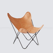 Leather butterfly chair with black metal legs