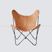 Leather butterfly chair with black legs