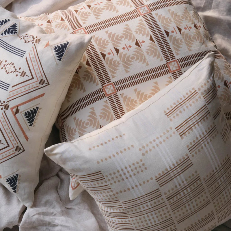 pile of blockprinted pillows, Ecru