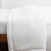 Buffy Comforter on Bed for The Citizenry
