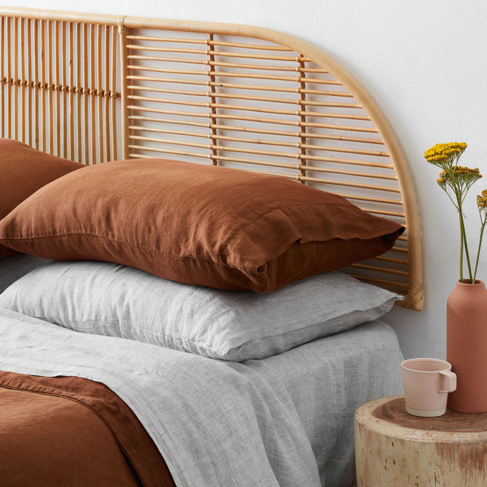 Close up of sienna and grey stripe pillows