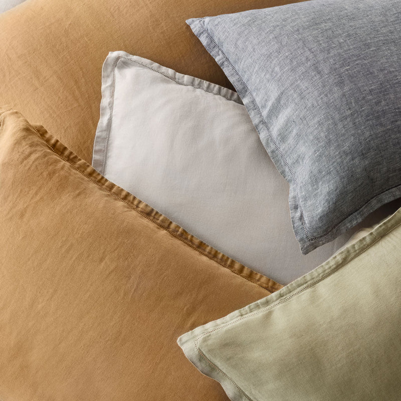 Pile of various euro shams, camel