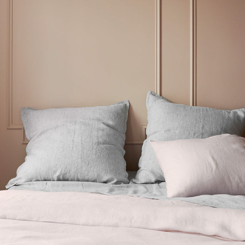 Stonewashed Linen Euro Shams on styled bed, graphite-stripe