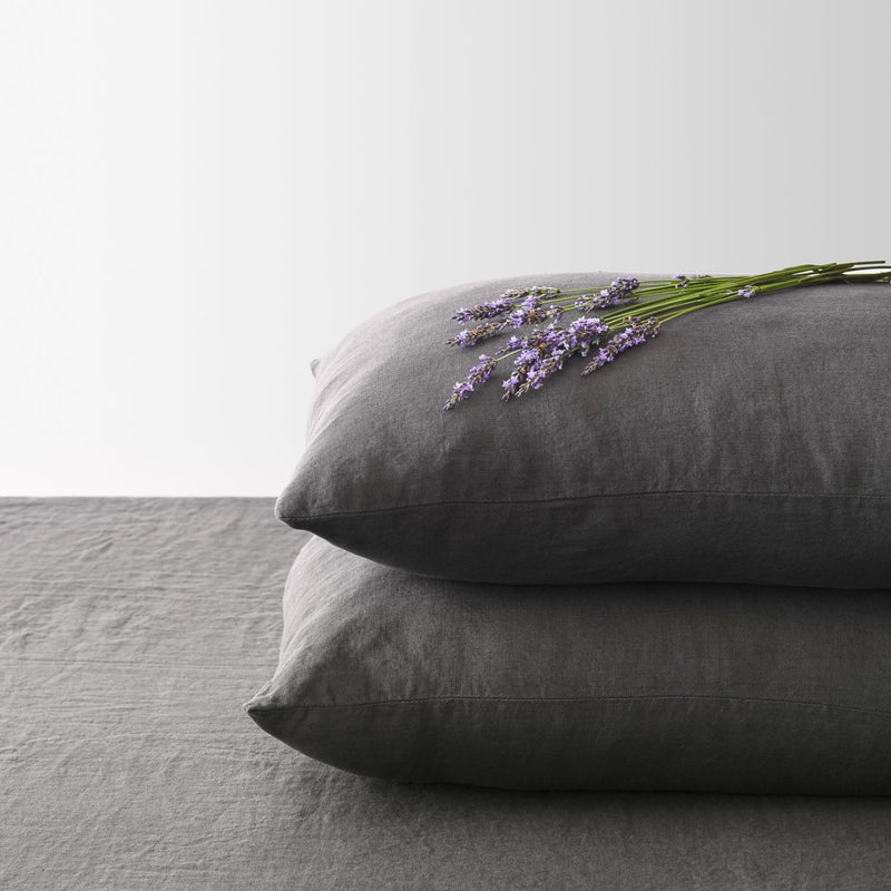 Corner of Charcoal Linen Pillowcases in a Stack, charcoal