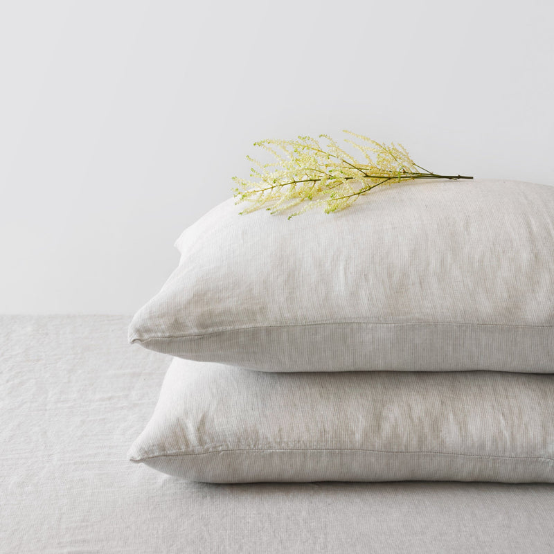 Corner of Beige Striped Linen Pillowcases in a Stack, sand-stripe