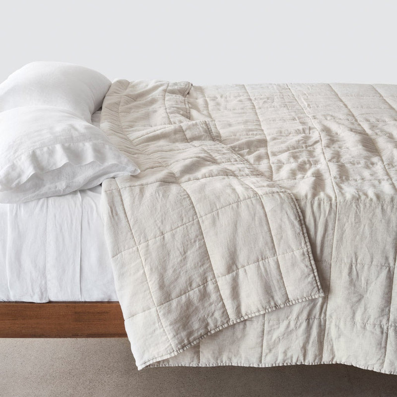 Side of bed with sand stripe stonewashed linen quilt, sand-stripe