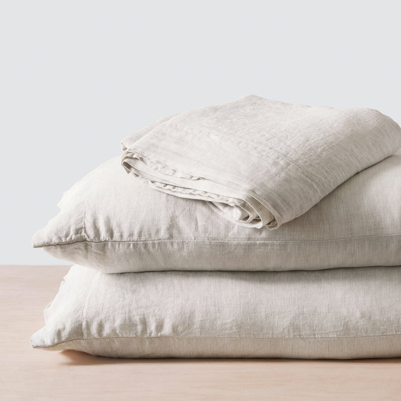 Folded Stack of Light Tan Pinstriped Linen Bedding, sand-stripe