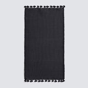 Black bath mat with tassels